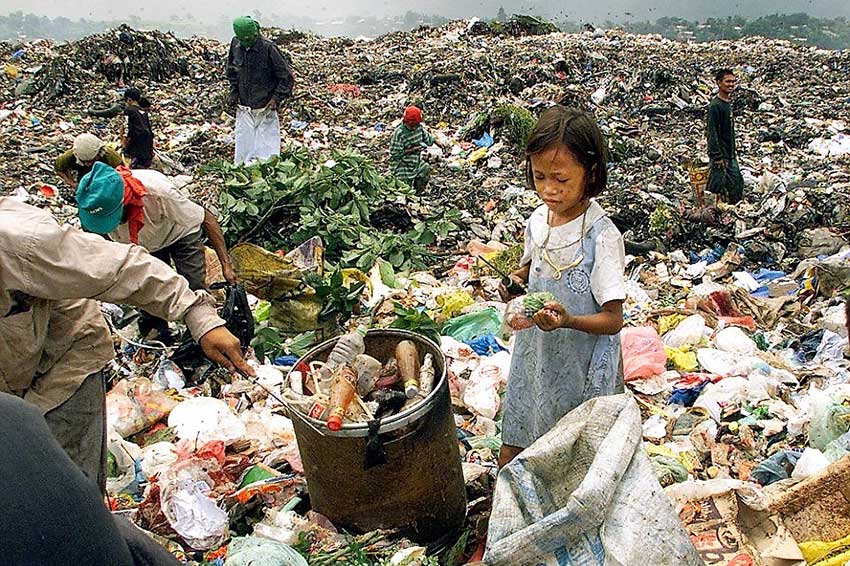 Children sorting rubbish on the dumpsite Manila