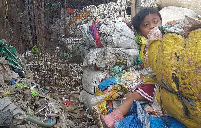 Young child working on the dump in Manila