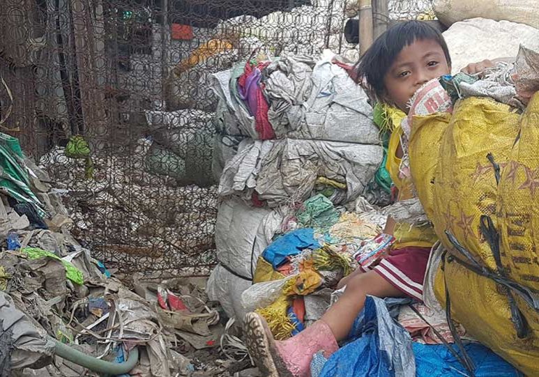 Young child working on the dump in Manila